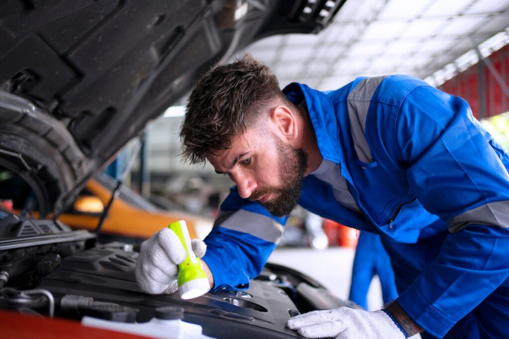 Mechanic work at auto repair shop.